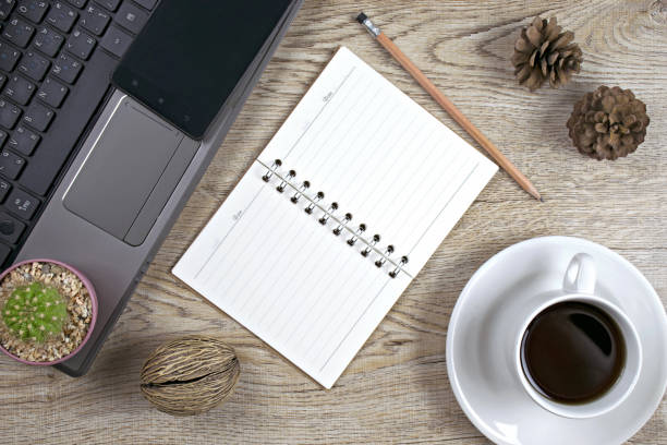 istock Office desk table with Notebook computer,smart phone.cup of coffee,book,pencil. 1358266215