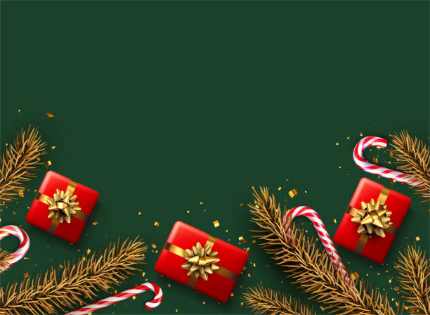 istock Striped candy cane sticks with golden spruce branch and gift box. 1358268198