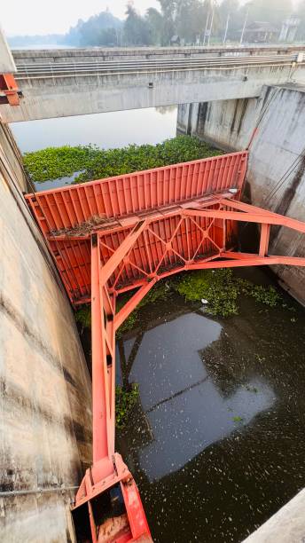 istock Steel sluice gate keeping water 1358268648