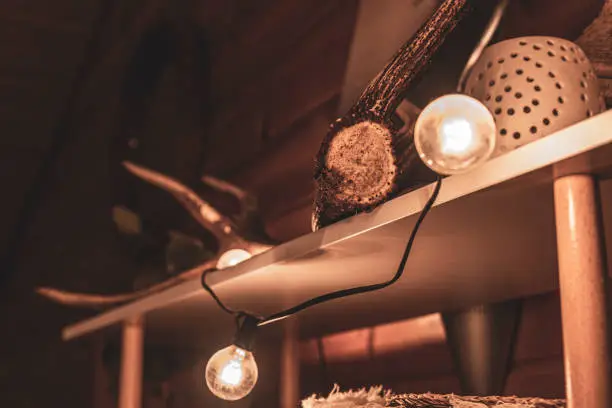 Beautiful picture of a wooden cabin interior decoration during the holiday season in the mountains of France.