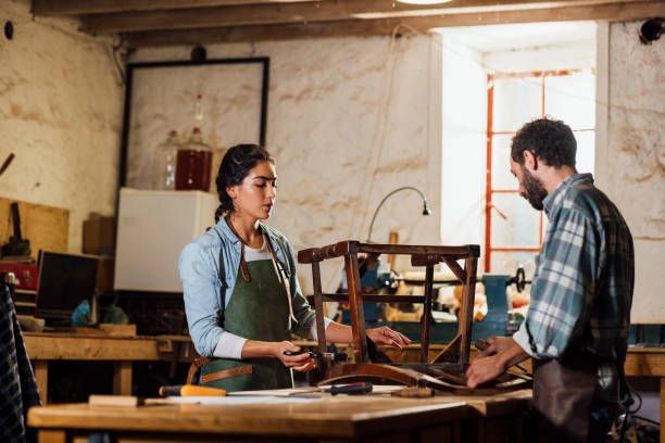 istock Working on a Chair Together 1358272023