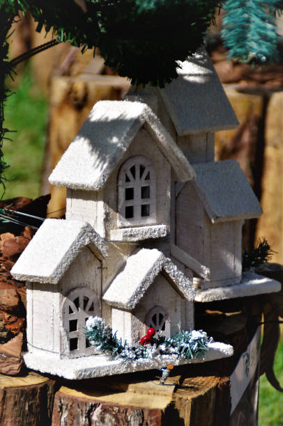 istock Wooden house decorating Christmas tree leg 1358272421