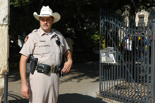 Texas, United States - September 22, 2006: Ranger at one of the entrance gates to the Alamo in the city of San Antonio