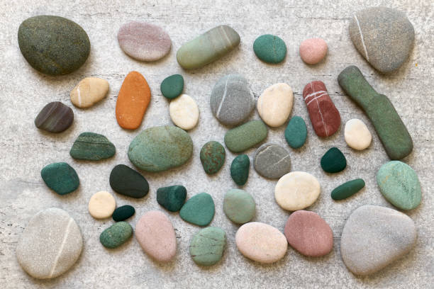 istock Colorful sea stones composition on gray background close up 1358277486