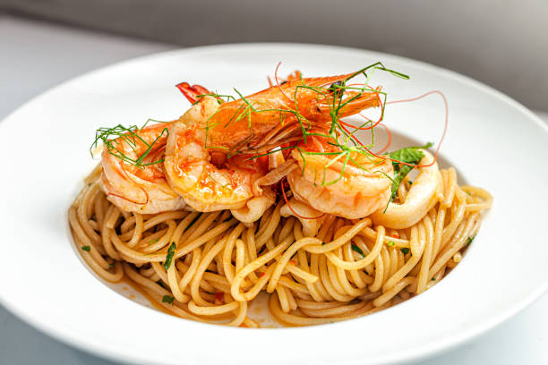 istock Shrimps Prawn Pasta Spaghetti served in a white plate 1358278493