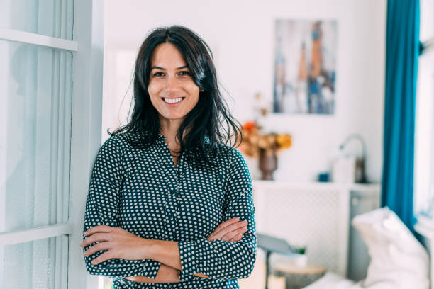 istock Confident businesswoman in modern office. 1358280224