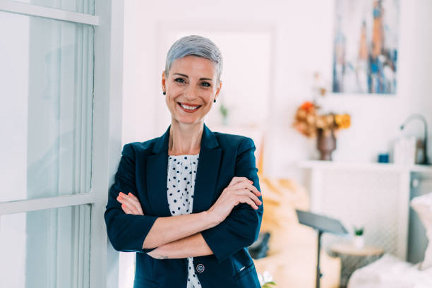 istock Confident businesswoman in modern office. 1358280391