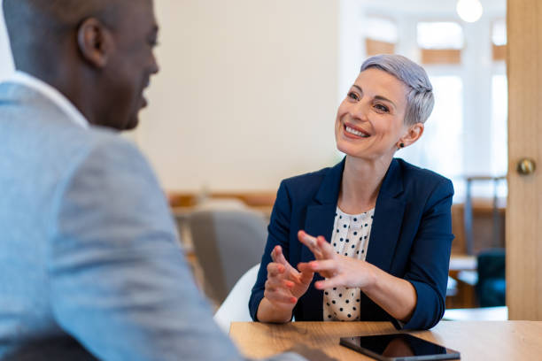 business partners in meeting. - gesturing interview business sitting imagens e fotografias de stock