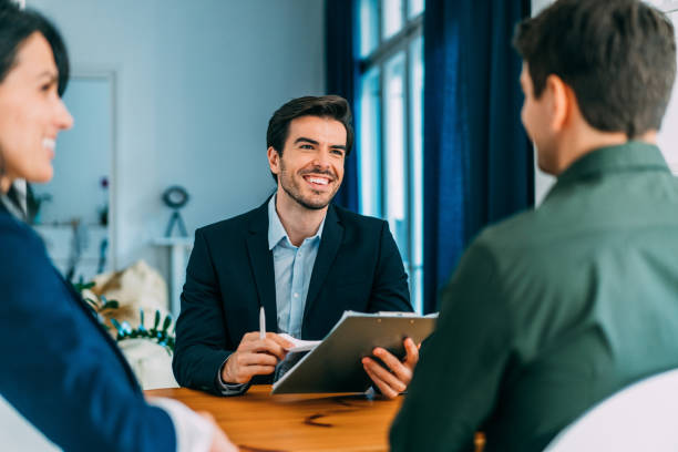 istock Group of business persons talking in the office. 1358280409