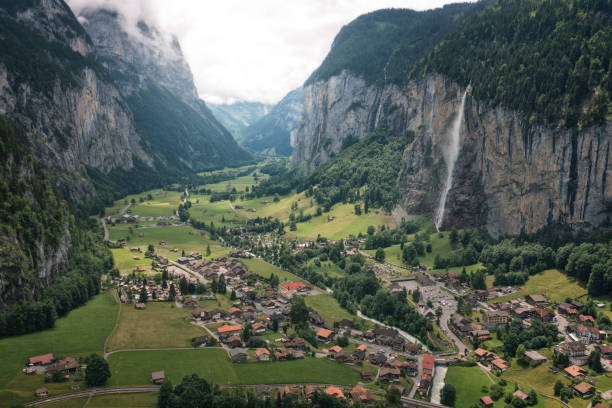 istock swiss valley with waterfall from aerial view 1358281112