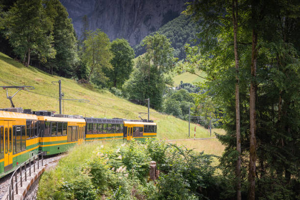 idyllic train of the Swiss valley in Lauterbrunnen, Canton of Bern, Switzerland
