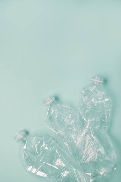 istock Many used plastic bottles background, top view. Recycling problem. Top view, copy space. Pollution, environmental protection concept 1358281848