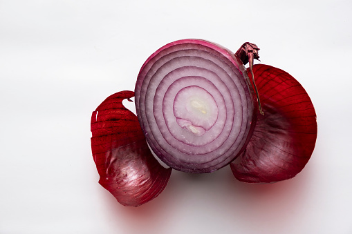 Half of fresh raw purple onion isolated on white background