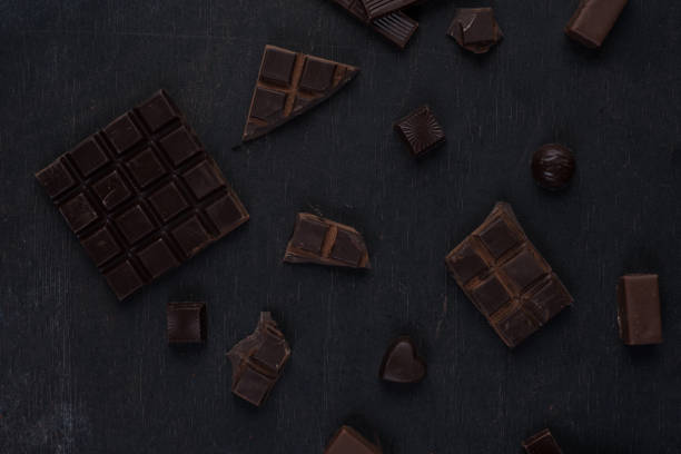 istock Top view of crushed dark chocolate bar with sweets 1358284562