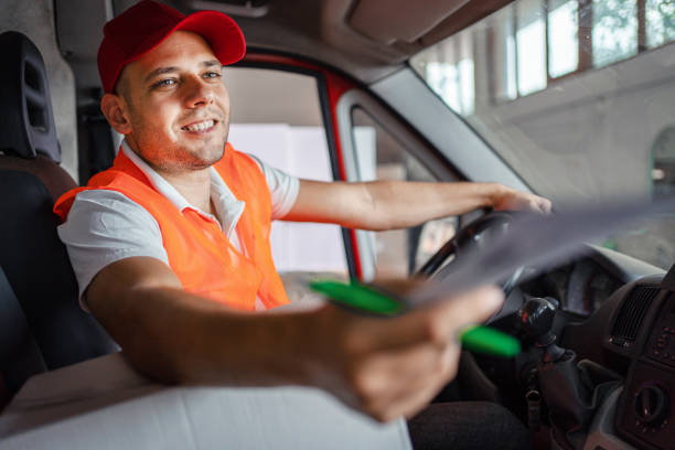 istock Young deliverer working from the delivery van 1358286659