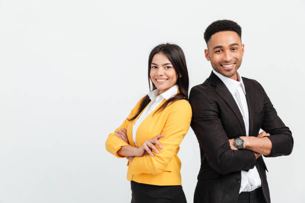 istock Happy colleagues business team standing over white background 1358287194