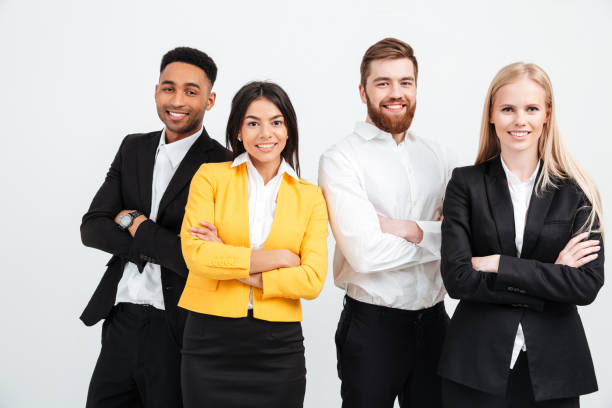 istock Happy colleagues business team standing in office 1358288078