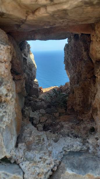 istock sea ​​view through antique window 1358289557