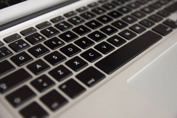 istock laptop's keyboard  view from the left oblique front side · left center part of the focused keyboard 1358292099
