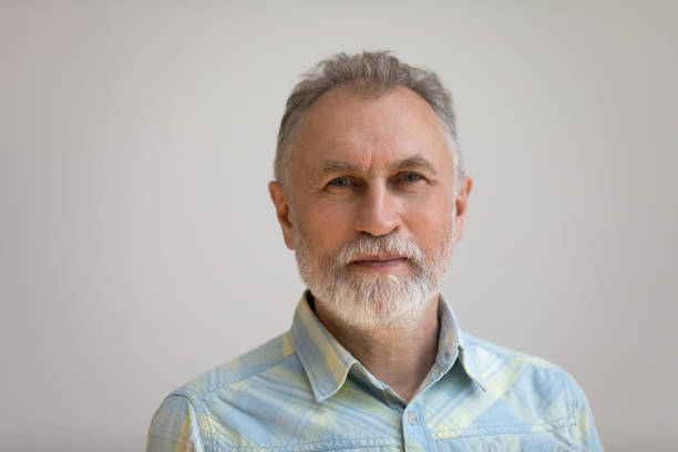 istock Serious older man in casual with beard head shot portrait 1358295159
