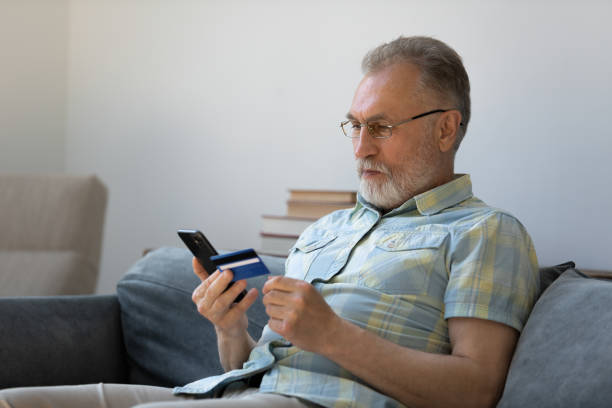 istock Focused senior older man using banking app, financial virtual service 1358295196