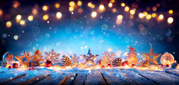 istock Christmas Decoration On Wooden Table In Blue Abstract Defocused Backdrop 1358296187
