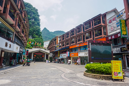 Yangshuo, China - May 18, 2019: Street life and beautiful mountain scenery