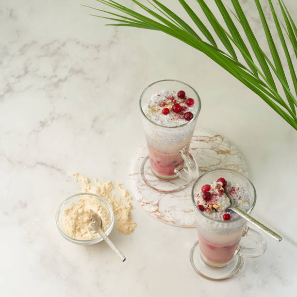 istock Dessert with chia seed pudding,jelly  a glass jar on a white background with a tropical palm tree 1358300733