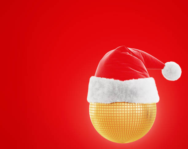 istock Santa's hat is dressed on a gold, round toy on a red background with a backlight. 3D rendering 1358301396