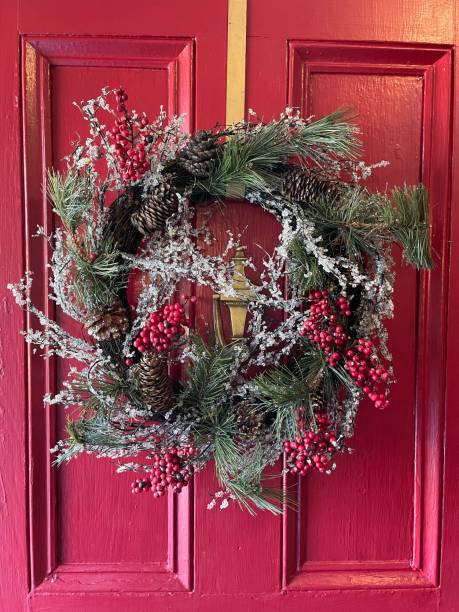 istock Christmas Wreath on Red Door 1358302597
