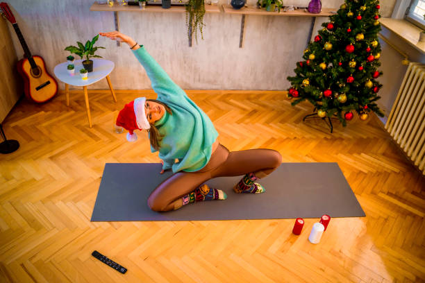 istock Woman doing yoga at home 1358306134