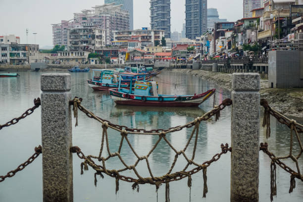Xiamen, China - June 7, 2019: Beautiful pond with old boats