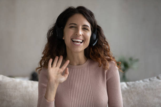 istock Joyful beautiful woman holding video call conversation. 1358310890