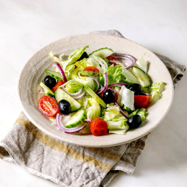istock Classic vegetable salad with tomatoes, cucumber, onion 1358310960