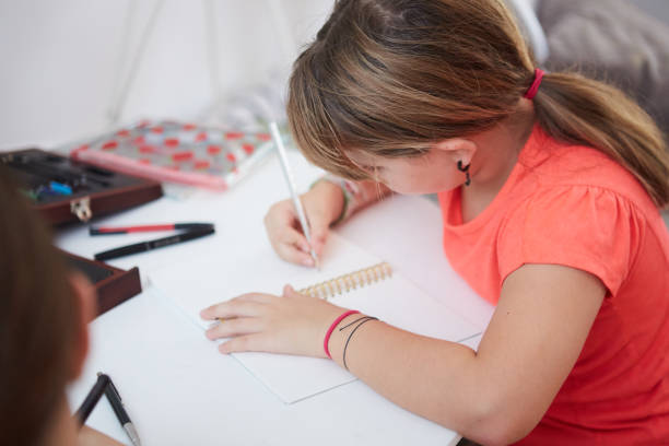 istock Girl Drawing at Home 1358314340