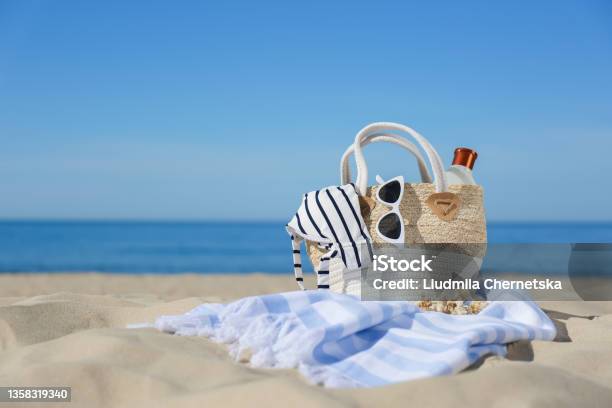 Stylish Beach Accessories For Summer Vacation On Sand Near Sea Space For Text Stock Photo - Download Image Now