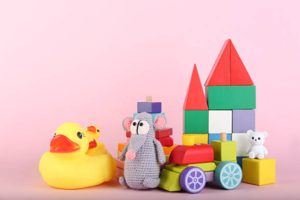 istock Set of different toys on pink background. Space for text 1358320589