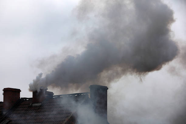 Smoke from the chimney, which is harmful and very toxic to humans Smoke from the chimney, which is harmful and very toxic to humans environmental pressure oven photos stock pictures, royalty-free photos & images