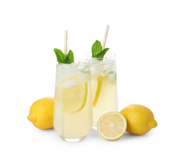 istock Natural lemonade with mint and fresh fruits on white background. Summer refreshing drink 1358322388