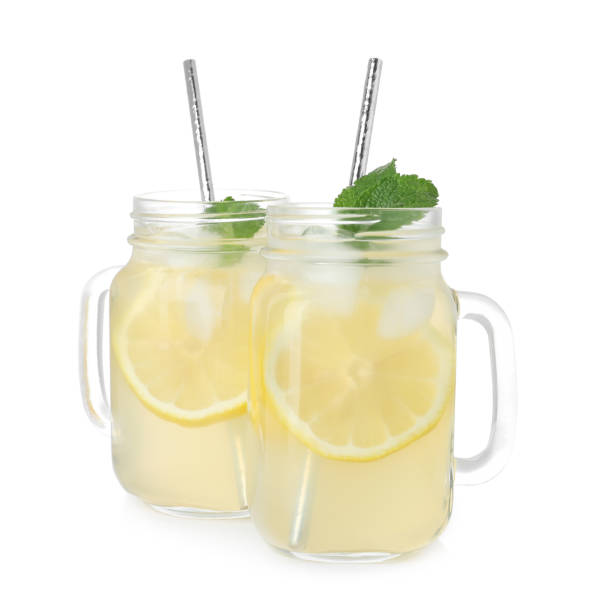 istock Natural lemonade with mint on white background. Summer refreshing drink 1358323222