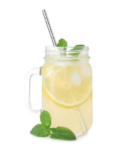 istock Natural lemonade with mint on white background. Summer refreshing drink 1358324052