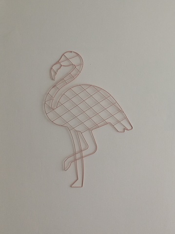 Flamingo figure hanging on the wall