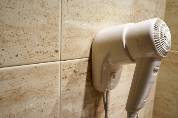 istock Hair dryer inside the bathroom 1358325617