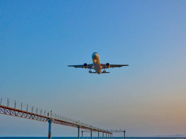 istock passenger plane about to land in the evening light 1358325657