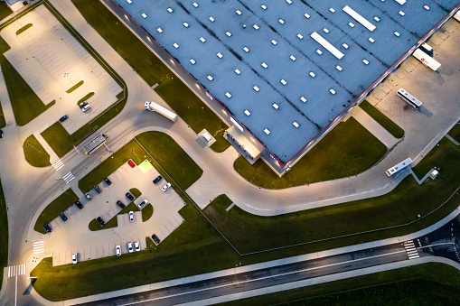 Night Aerial view of goods warehouse. Logistics center in indust in Stryków, Łódź Voivodeship, Poland