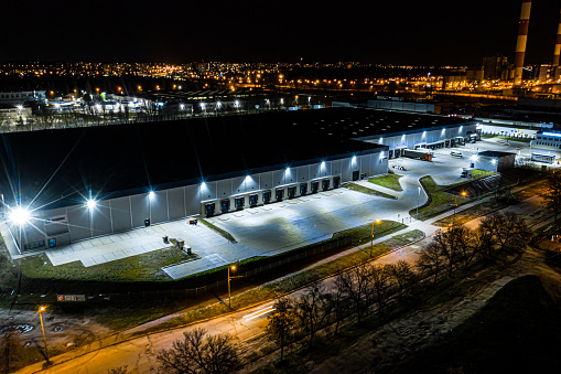 Night Aerial view of goods warehouse. Logistics center in indust in Łódź, Łódź Voivodeship, Poland