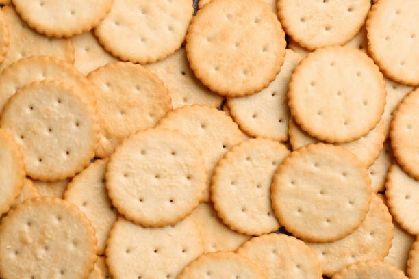 istock Many delicious crackers as background, top view 1358326011