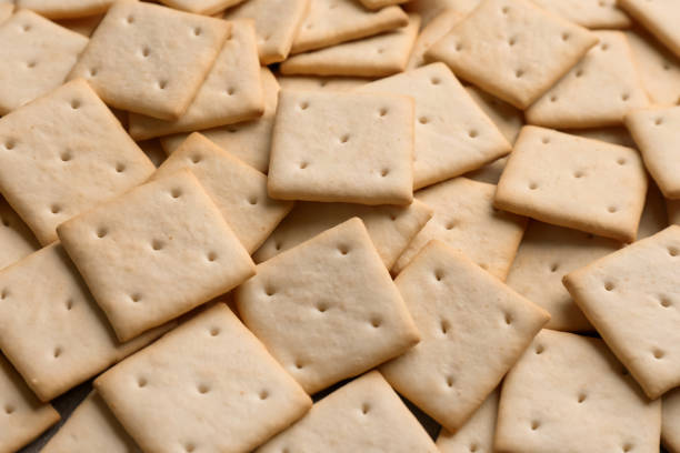 istock Many delicious crackers as background, closeup view 1358327664