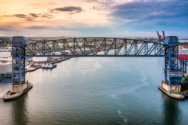 istock Aerial view of Arthur Kill vertical lift bridge at sunset 1358329540