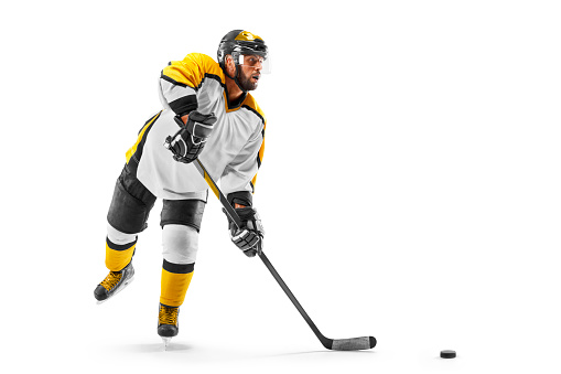 Athlete in action. Professional hockey player on white background. Sports emotions. Hockey concept. Isolated